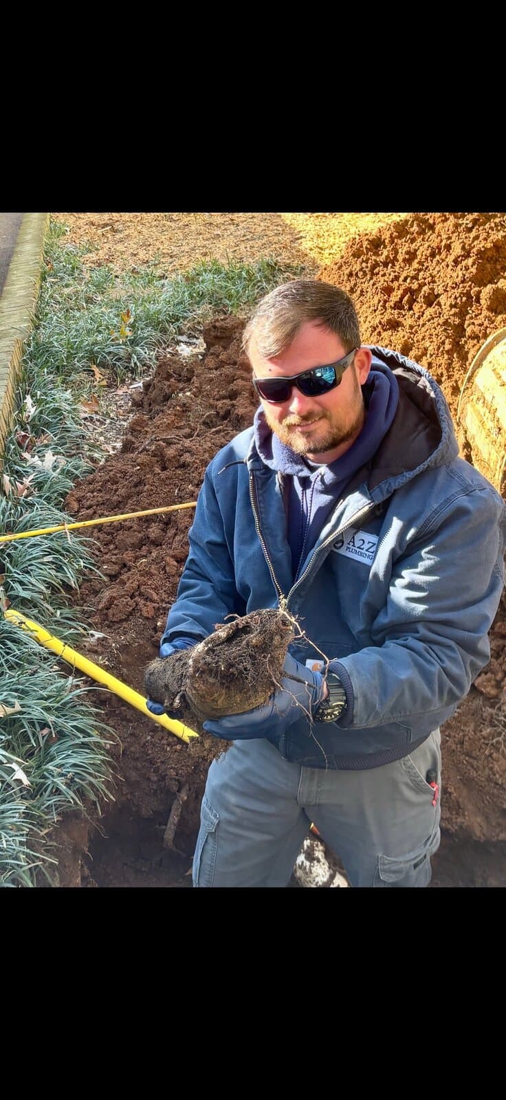 Daniel from A2Z Plumbing working on sewer line excavation
