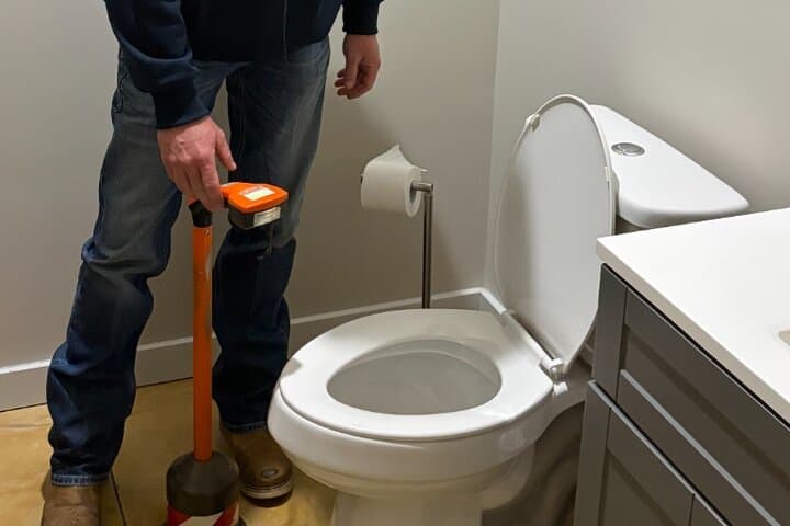 Master plumber using leak detection equipment in Huntsville AL